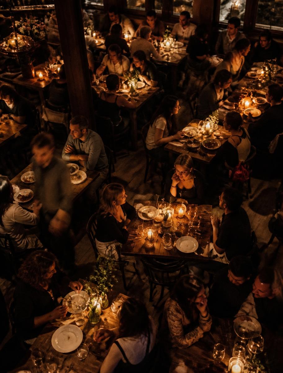 Guests dining by candlelight in the Rumsey Tavern dining room, photographed from above
